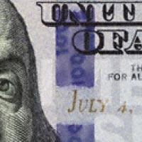 Close up of 3D security ribbon in 2013 $100 bill.