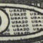 texto USA 20 pequeño dentro del número 20 grande